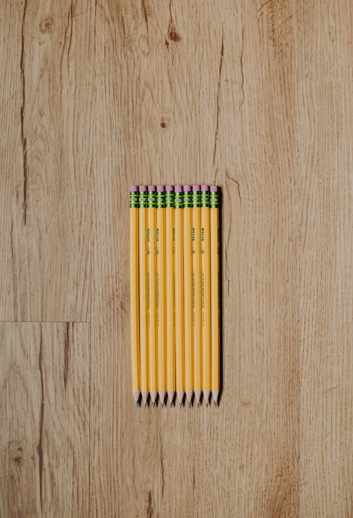 #2 pencils laying on a wood floor